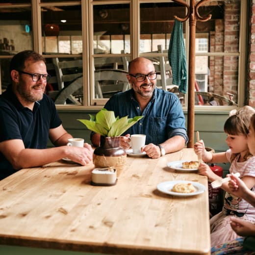Family sit in a cafe