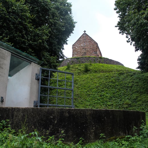 A concrete bunker next to a chapel