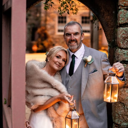 Couple hold lanterns