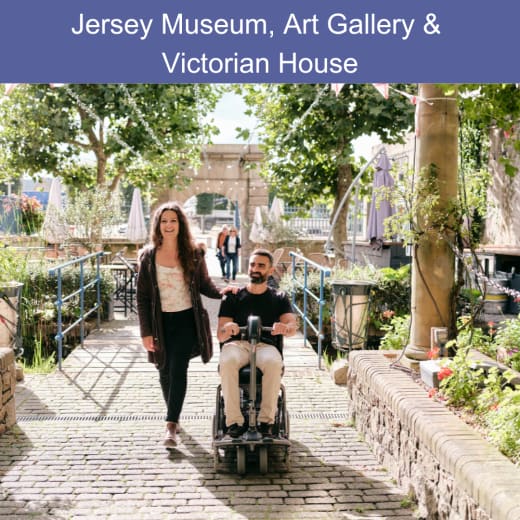 Person in wheelchair and a person walking