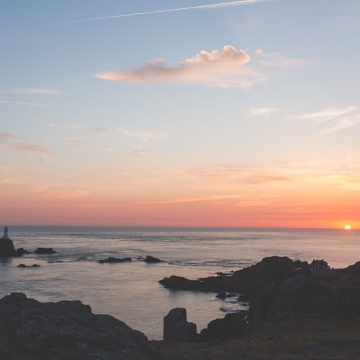 Sunset bay with a tower in the forefornt