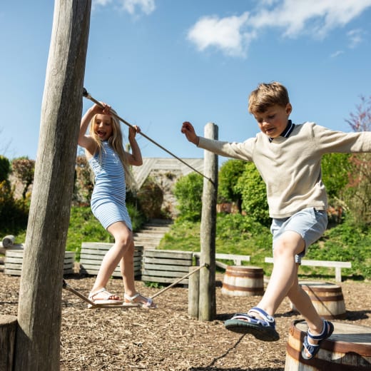 two children play in a playground