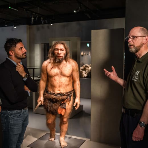 a guide talks to a group