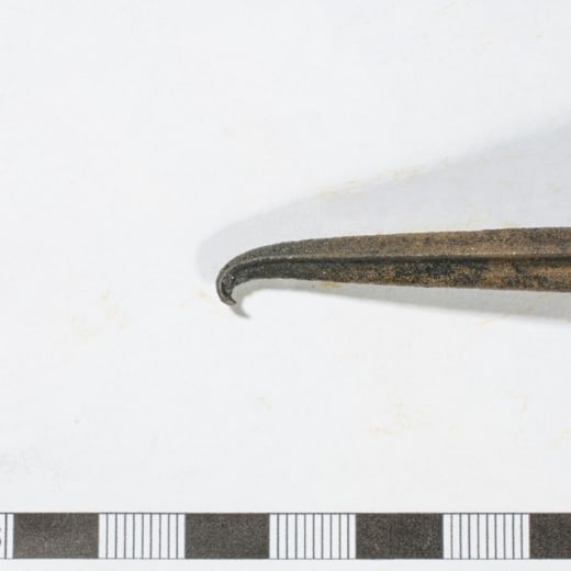 The damaged tip of the spearhead