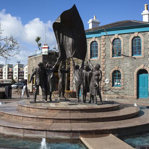 A statue of people celebrating