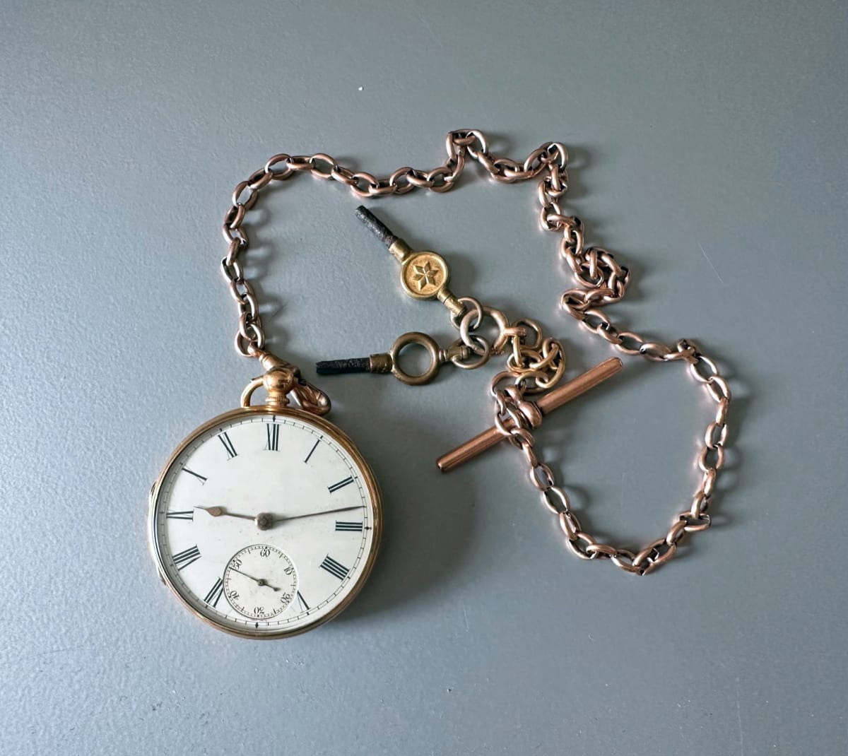 A silver pocket watch and chain