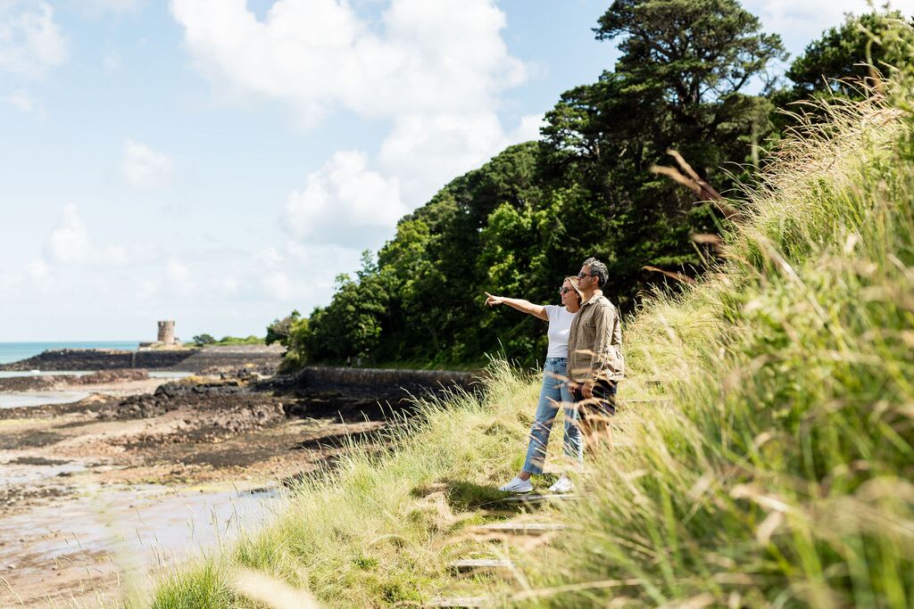 Two walkers on a beach