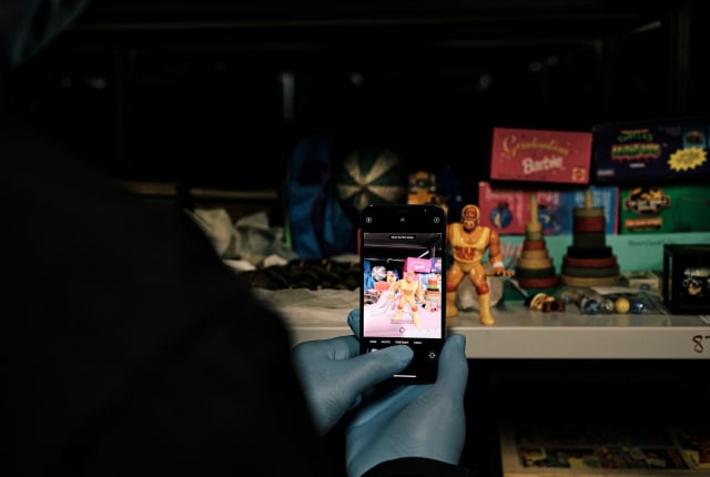 Sir Francis Cook man takes photo of toys