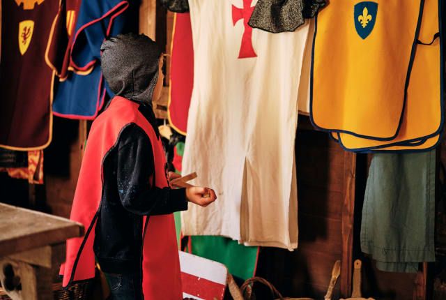 Mont Orgeuil Castle boy chooses dressing up costume
