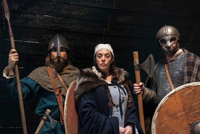 Three people dressed as Vikings
