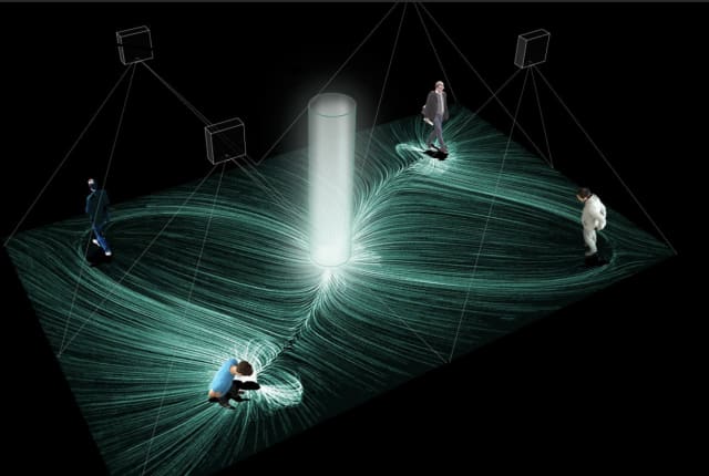 A digital representation of a totem pole made of light with four people walking around it