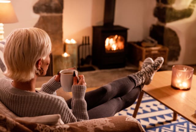 Woman relaxes with cup of tea
