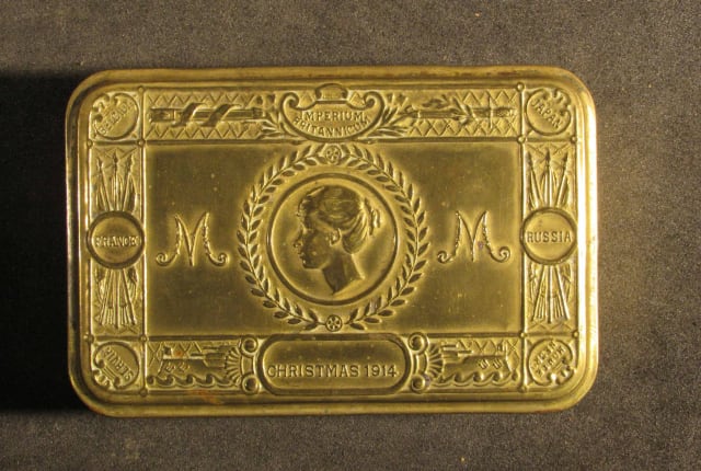 A gold coloured tin