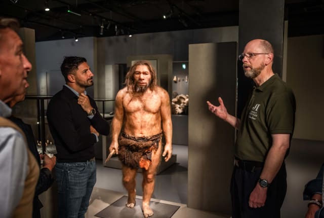 a guide talks to a group