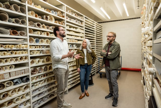 People take a tour of an archive facility