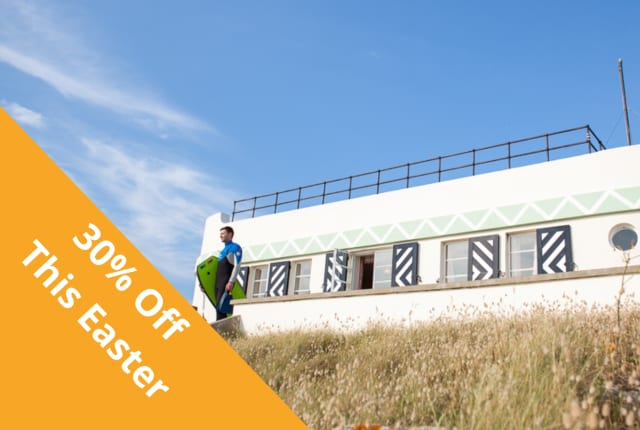 A white building with a surfer