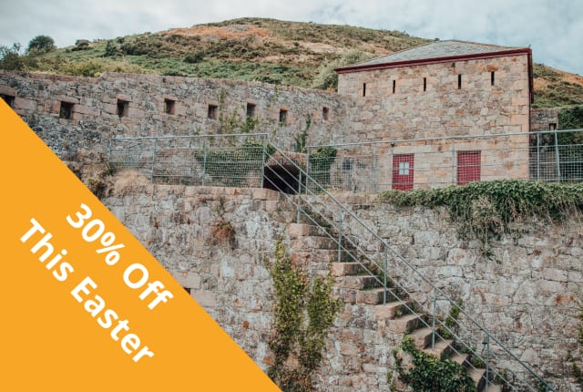 a stone fort with red doors