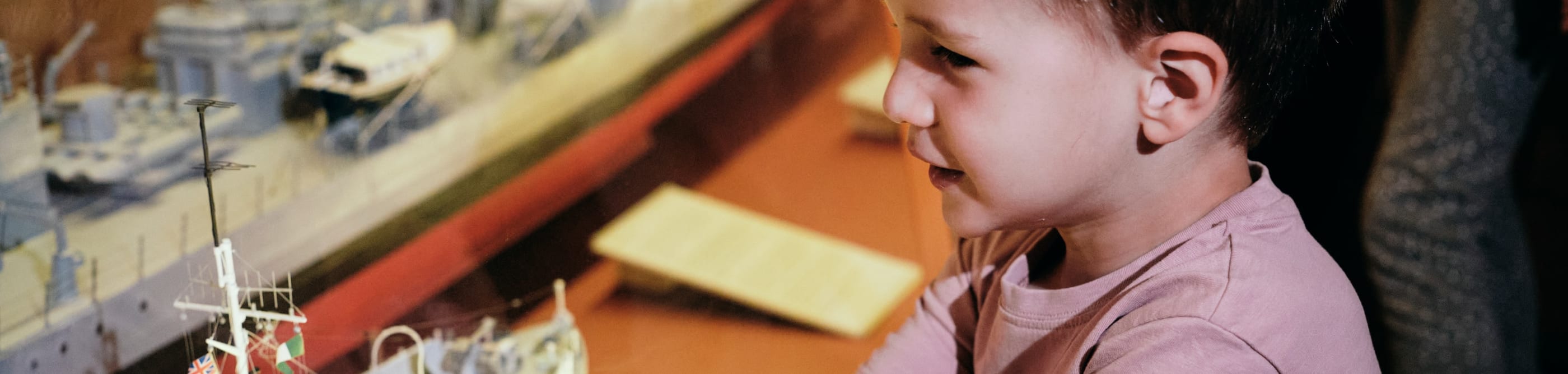 Maritime Museum child looks at model boat