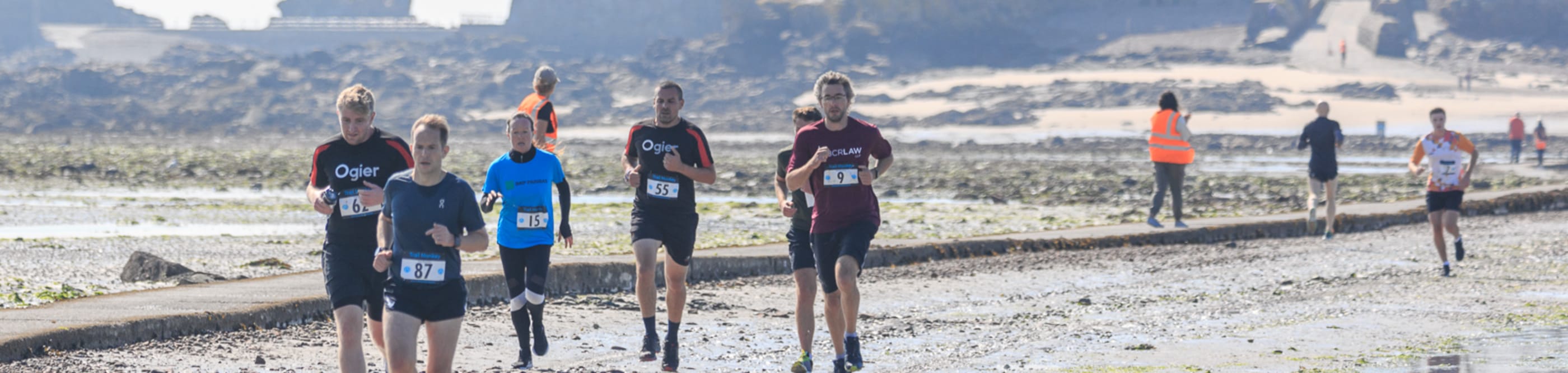 People running on a beach