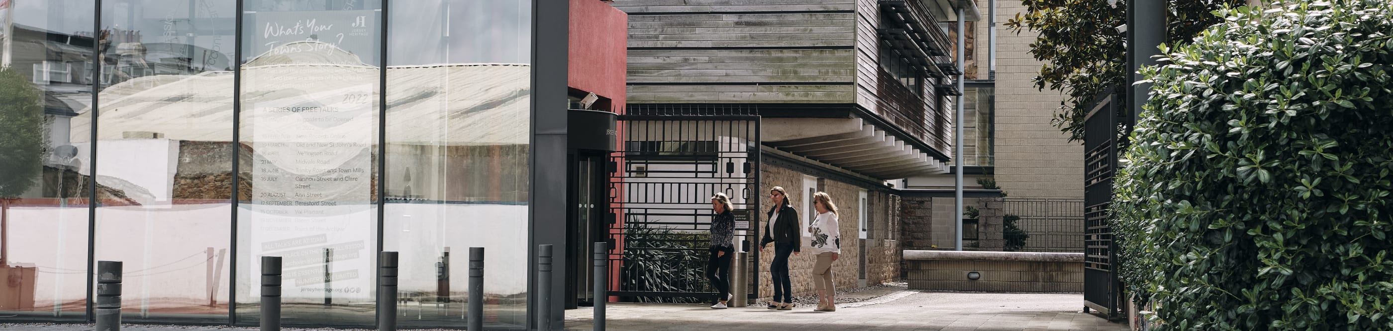 Jersey Archive view of entrance to archive and three people at entrance