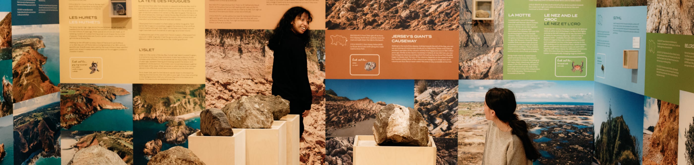Two people look at exhibits