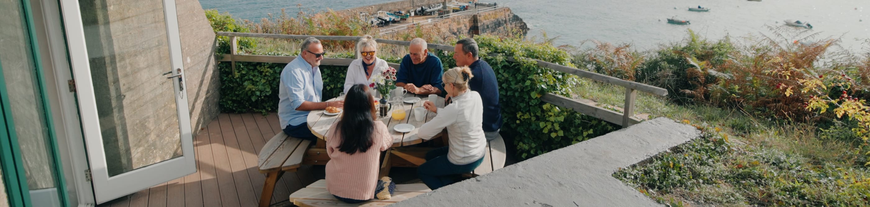 Group have lunch outside a fort