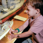 Maritime Museum child looks at model boat