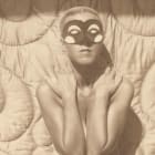 Claude Cahun does a masked pose