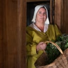 Women dressed as housekeeper from 1600s