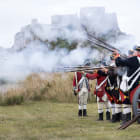 Men fire guns dressed as 1781 Jersey Militia