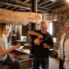 four people tasting cider