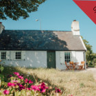 A white cottage in a garden