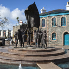 A statue of people celebrating