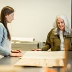 A conservation expert speaks to two people