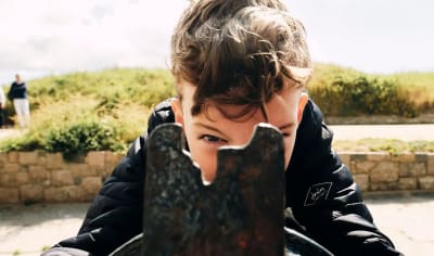 Elizabeth Castle Child eyes the sights on a cannon