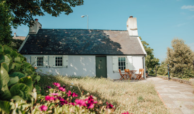 Fishermans Cottage Exterior with Flowers in foreground