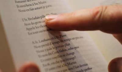Finger pointing at a book