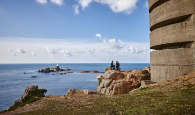 Two people sitting on the headland