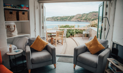 Living room with two chairs and a view of a bay