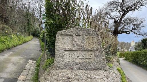 A stone marker by the roadside with carvings of two dates – 1891 AD and 6854 AM