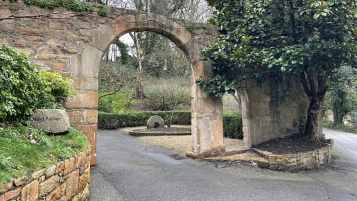 Two granite arches across a road