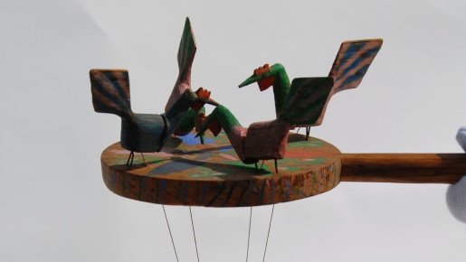 A wooden toy with birds