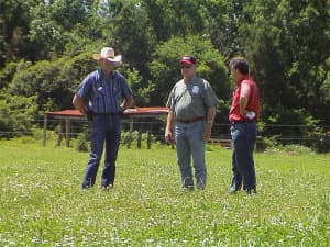 Research Associate Marion Cornelius Dixon discusses Persist with visitors to the Ames Plantation in June 2005.