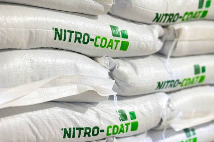 Nitrocoat bags and coated seed palletized for storage and transport.