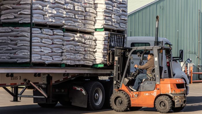 Forklift loading truck.