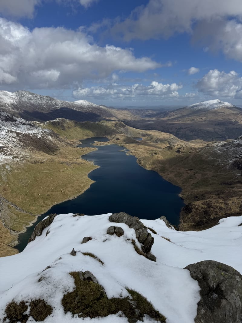 Looking down from Bwlch Y Saethau to Llyn Llydaw and the snow-covered cwm below