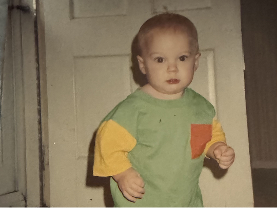 Jeff as a toddler in a green shirt