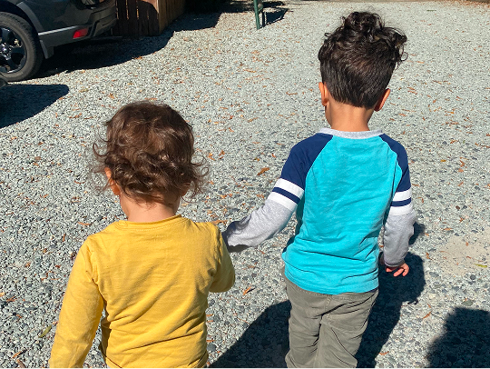 Jeff's two kids walking hand in hand