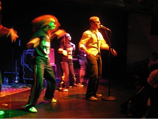 Jeff performing on stage with his band
