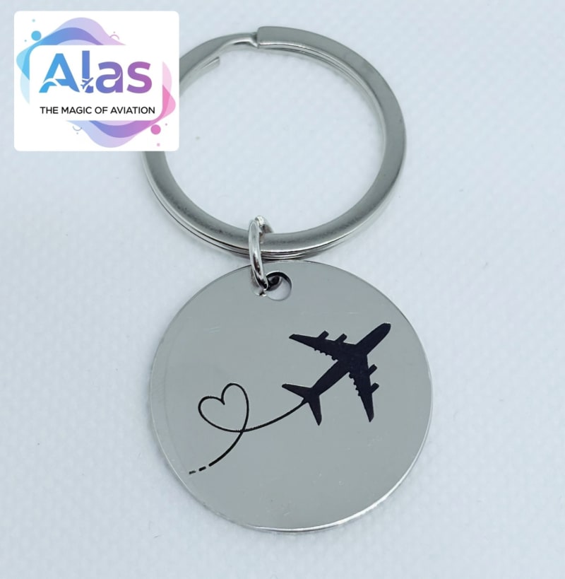 Llavero circular con avión y corazón ✈️💙 1